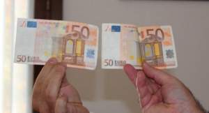 Bancnote false de 50 de Euro, plasate în mai multe orașe din țară de un grup de infractori din Petroșani: banii falși erau aduși din Italia